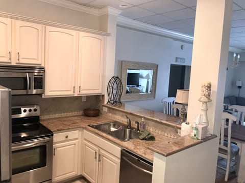 kitchen-breakfast bar (barstools located on other side of bar)