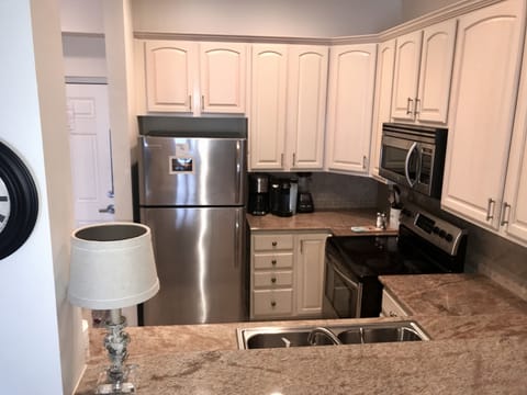 upscale kitchen, granite counters and stainless steal appliances- fully stoc