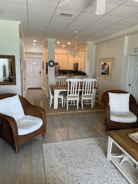 from living room looking into entry, kitchen and dining area