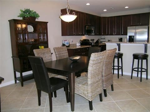 Dining Room(seating for 6) with hutch stocked with bar/glassware.