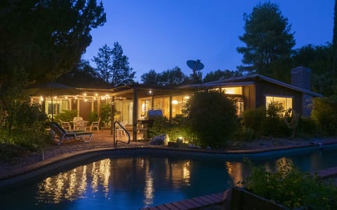Summer nights are cool with a lighted patio and pool
