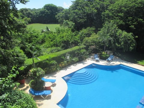 View of pool and golf course from our balcony.