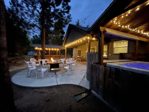 Patio showing hot tub, summer fire pit and bbq area
