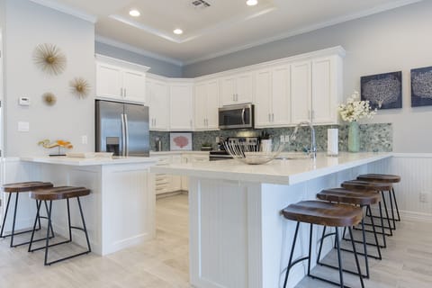 Spacious kitchen fully equipped with kitchen utensils and extra seating!