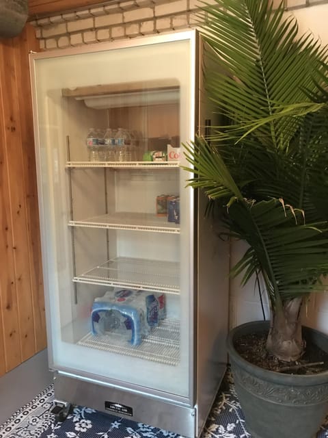 extra refrigerator on lower level right inside entry door.