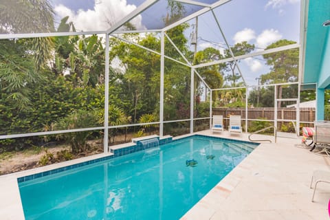 Plenty of seating around the pool. Property is enclosed on all sides