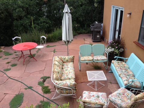 Aerial view of back patio. Weber grill.