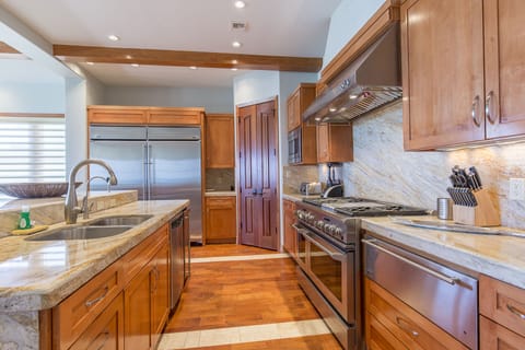 This kitchen is built for a chef! 
Huge refrigerator and freezer, gas stove, warming trey, and ice maker!