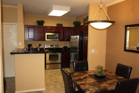 Kitchen with stainless steel appliances and granite counters.