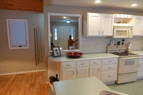 View of front door through kitchen