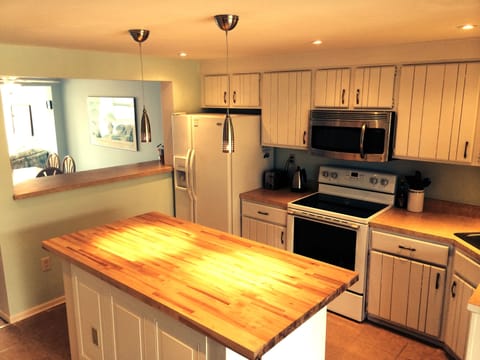 Open Kitchen with Butcher Block Island Top 