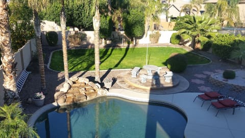 Backyard from the balcony showing large grass area