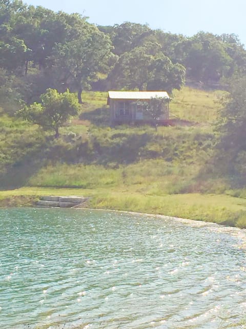 View of cabin from across the lake