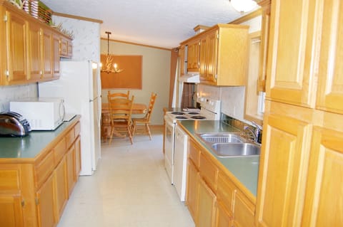 Fully applianced kitchen with stocked cupboards for your cooking/baking needs.