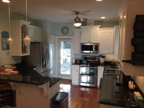 Enjoy convenient back door access to gas grill & garage