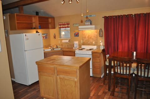 Rolling island provides extra counter space for food prep.