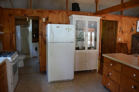 Kitchen and 3/4 bath with washer, drying racks or outdoor clothesline.  