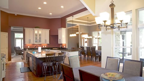 1st floor kitchen with two dinings rooms and two bar side seating