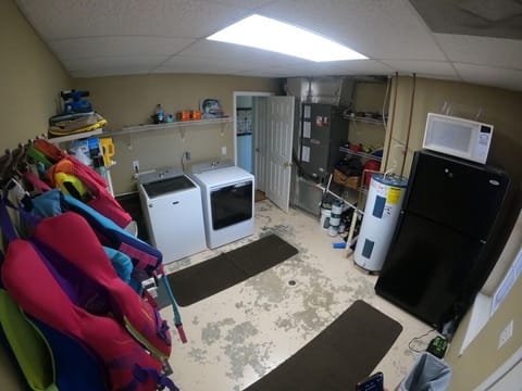 Mud/laundry room with beverage fridge, just off of screened in deck.