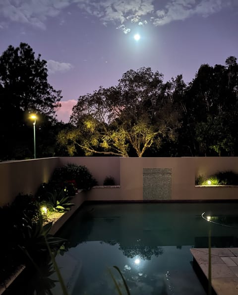 Shimmering moonlight around the pool
