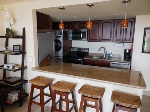 Granite Counters,  Stainless Appliances in make for an inviting kitchen