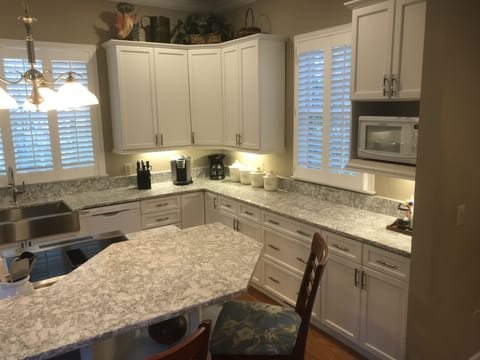 Remodeled kitchen features Cambria Quartz countertops and Shaker style cabinets.