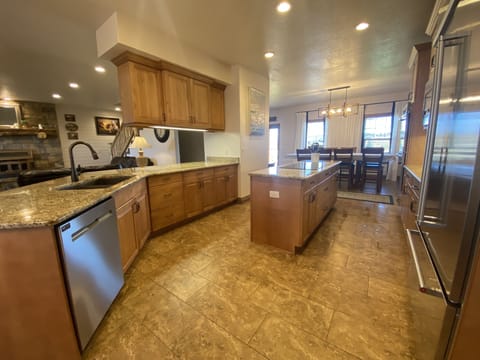 From the breakfast nook, Bar has 6 stools. 23 seats for dining in this area
