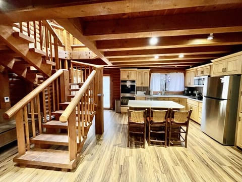 Double Ovens, Dishwasher, Exterior balcony and window over the sink.