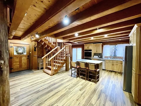 Front door to kitchen Stairs to the loft & doors to the kitchen patio