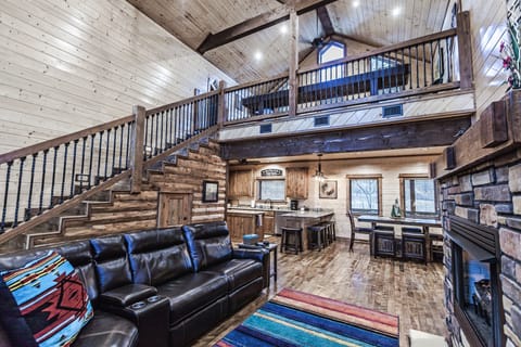 Great Room showing dining table and kitchen bar area. 