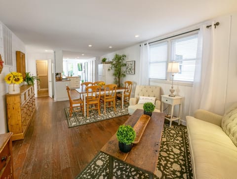Enter into a a cozy living room and one of the two dining areas in this beautiful coastal house.