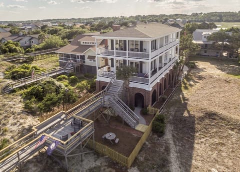 Aerial View of House and fenced in front yard