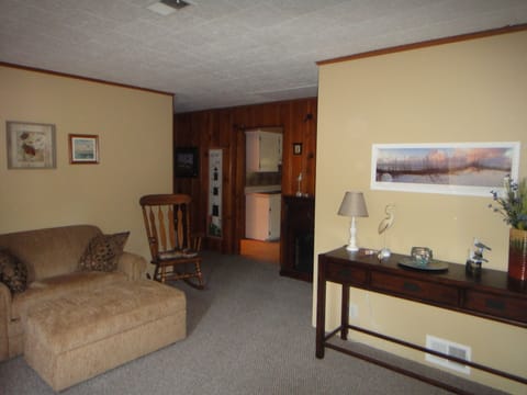 WELCOME!!  Front Entry and big cosy chair that folds out into a twin bed. 