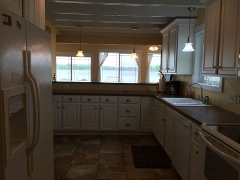 Fully stocked kitchen, dishwasher, oven, micro and fridge w/ filtered water/ice.