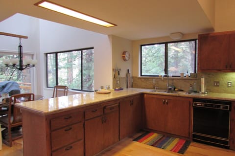 Spacious kitchen w/ bar top, & 2 stools on the dining side for additional eating