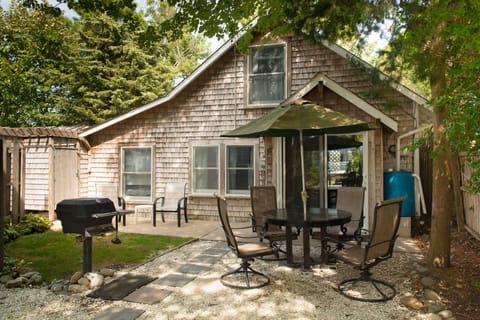 Quiet cottage set back from road with shady yard for outside relaxation. 
