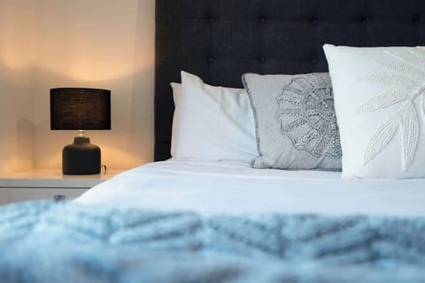 Sink into ultimate comfort. Our plush bed, soft pillows, and cozy lighting create the perfect ambiance for a restful night's sleep.