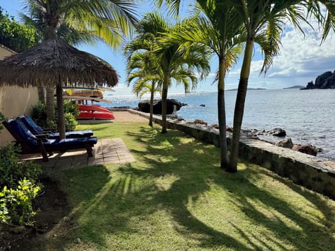 A private, relaxing  area, just feet from Caribbean water. 