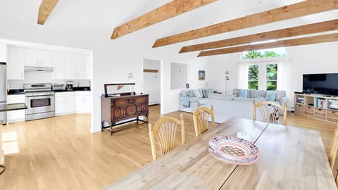 Dining area with kitchen and living room beyond