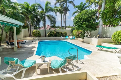 View from Guesthouse on the pool in tropical garden