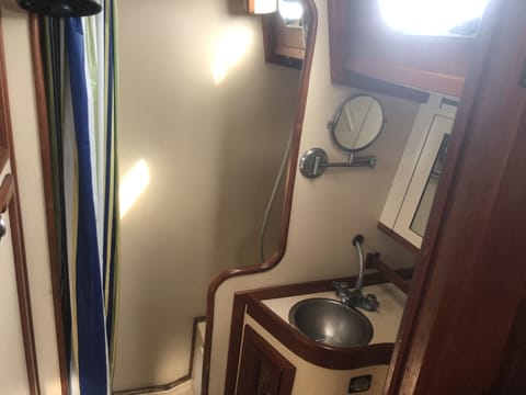 Large head/bathroom with standing shower or use land based facilities with key