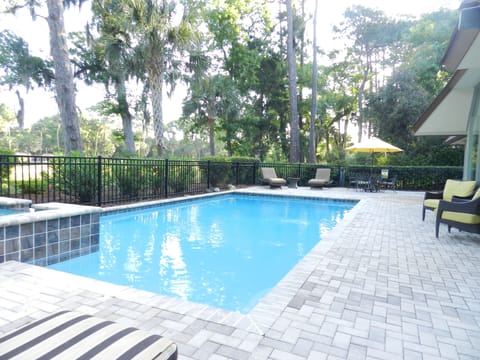Sunny pool with plentiful and comfortable seating