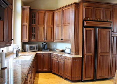 Kitchen w/ coffee makers, microwave, toasters & filtered water system. 