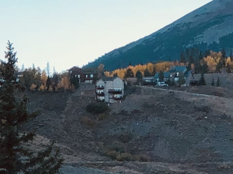 Light tan house on the hill