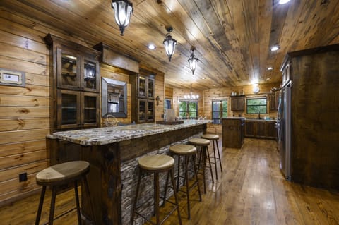 6 seats at the bar in the kitchen.