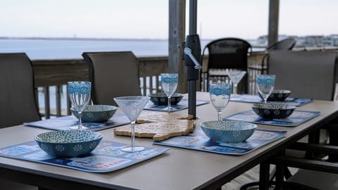 Gather for meals and sunrises on the deck—unforgettable bayfront views included.