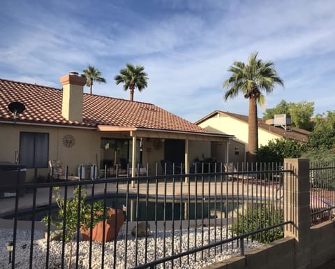 A beautiful back yard awaits you with pool, hot tub and a golf course view 
