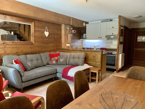 Living area with comfortable French Connection Corner sofa overlooking meadow
