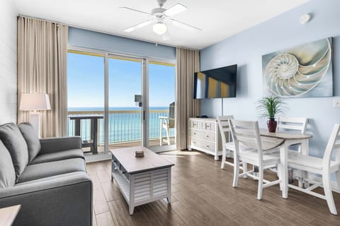Living Room -Experience luxury and comfort in this beachfront retreat with a large flat-screen TV, chic decor, and stunning views of the ocean right from your couch.