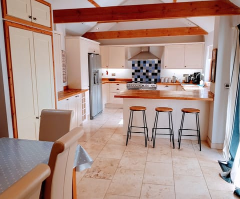 Fully equipped dining kitchen. Doors to garden